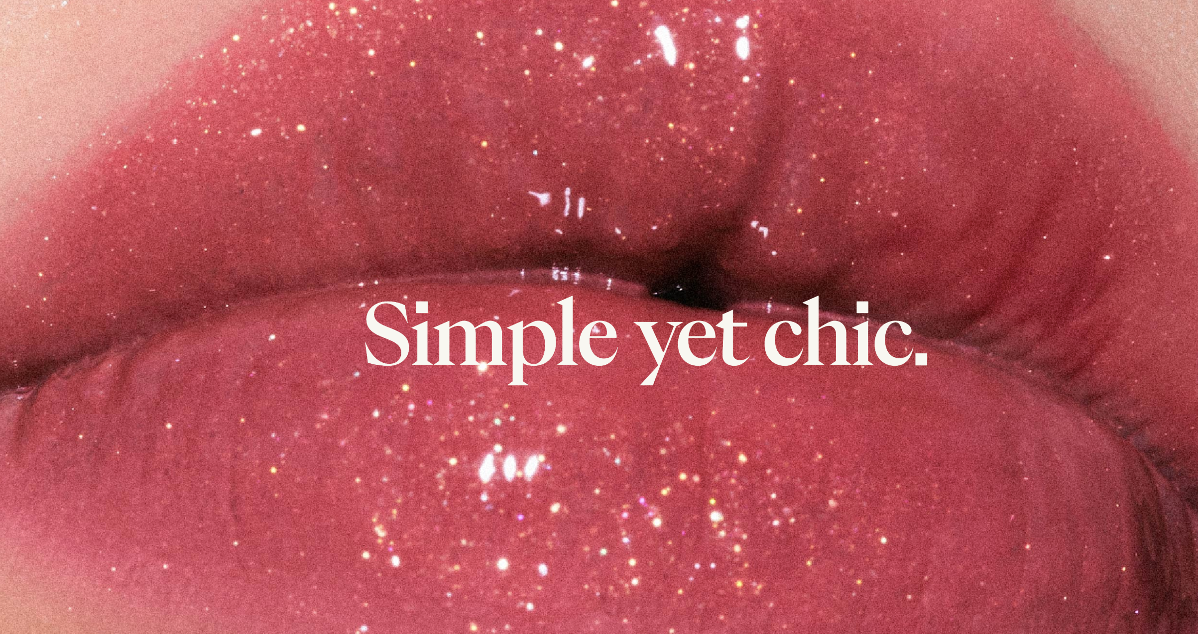 Close-up editorial image of glossy sparkling pink lips with the words Simple yet chic
